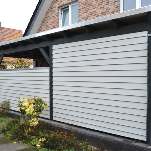 Flachdachcarport mit Leimholzbogen und Abstellraum Oelde